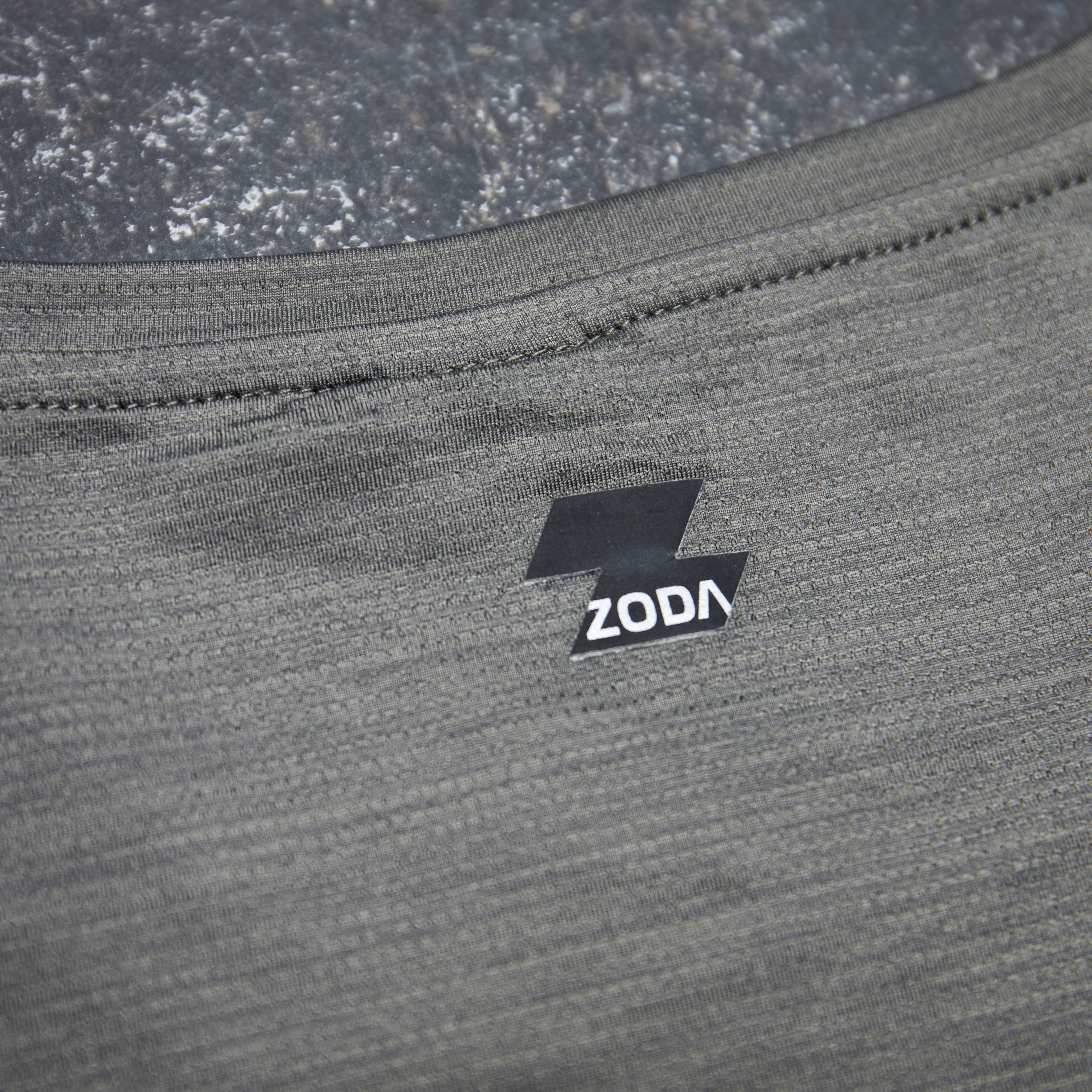 Close-up of a gray fabric with a ZODA logo on a textured surface. Zoda.sg
