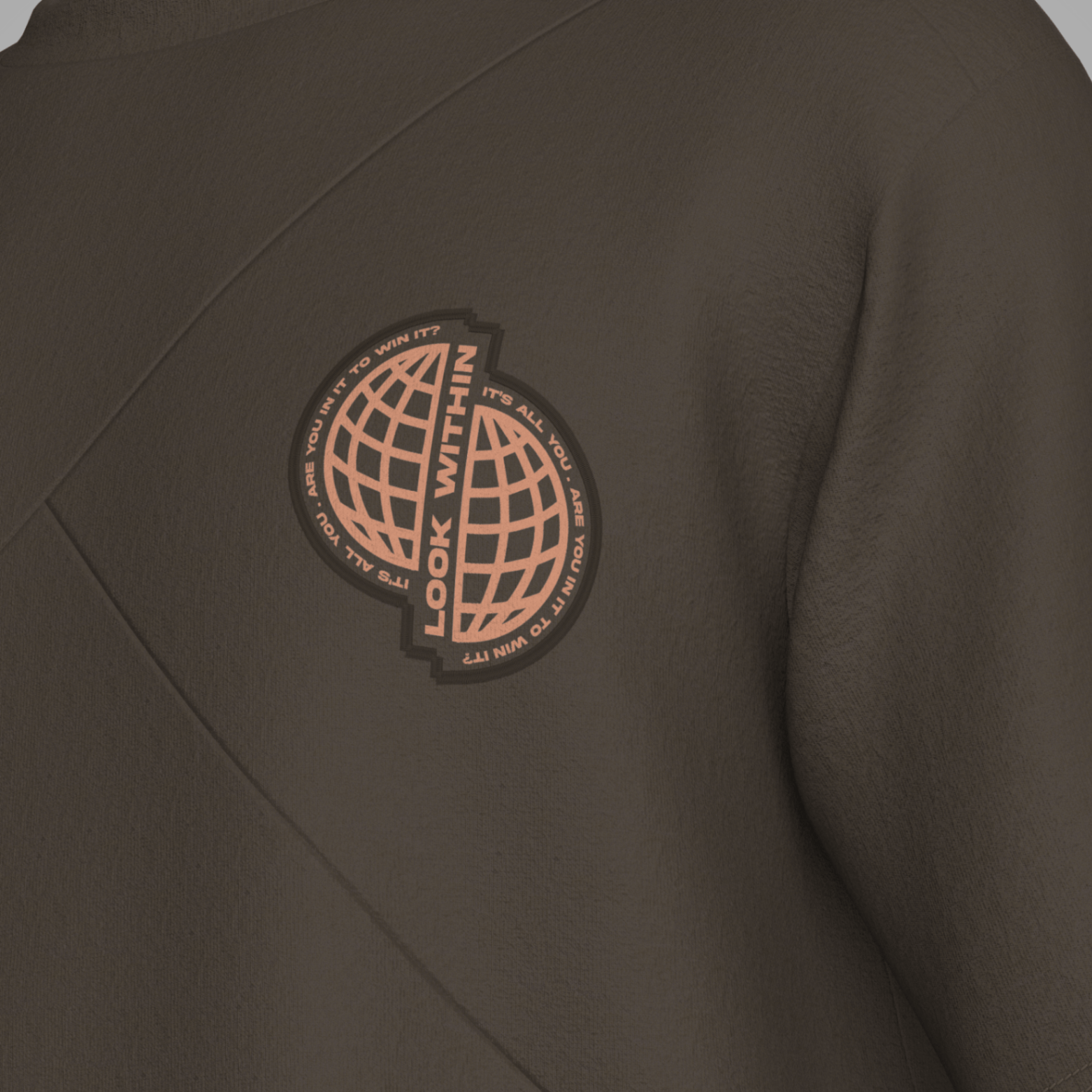 Brown sweatshirt with a circular patch featuring text and a globe design on the chest. Zoda.sg