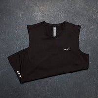 Black sleeveless shirt with 'Zoda' branding on a gray surface Zoda.sg