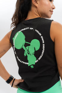 A person wearing a black cropped tee with a green graphic of a weightlifting motif and text. Zoda.sg