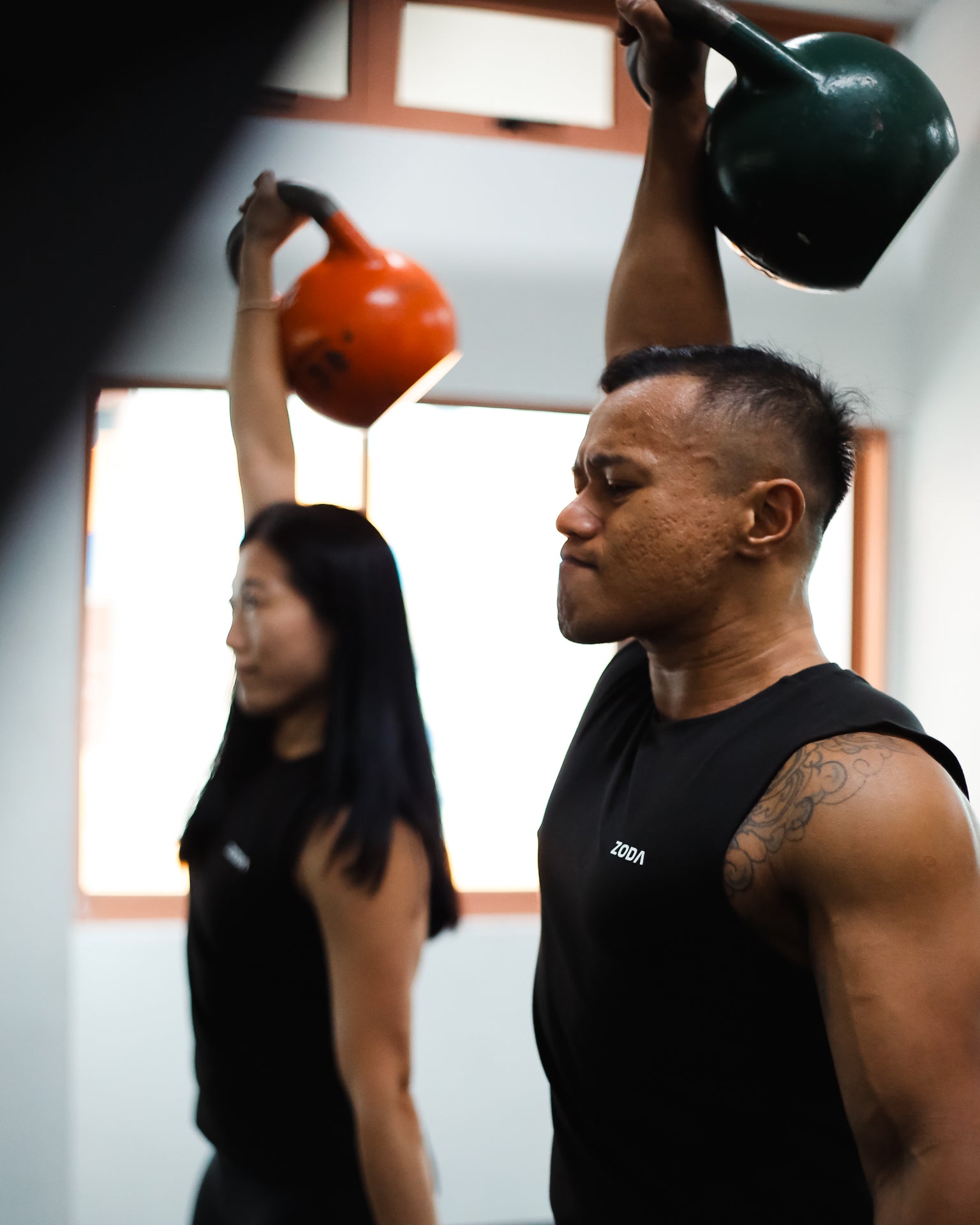 Mand and Woman doing exercise training Zoda.sg In it to win it, Singapore
